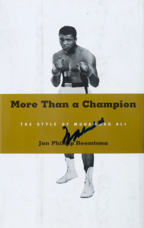 MUHAMMAD ALI TWICE SIGNED MORE THAN A CHAMPION BOOK WITH ORIGINAL DRAWING AND INSCRIPTION