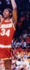 HAKEEM OLAJUWON SIGNED PHOTOGRAPH GROUP OF THREE WITH YOUTH JERSEY - 2