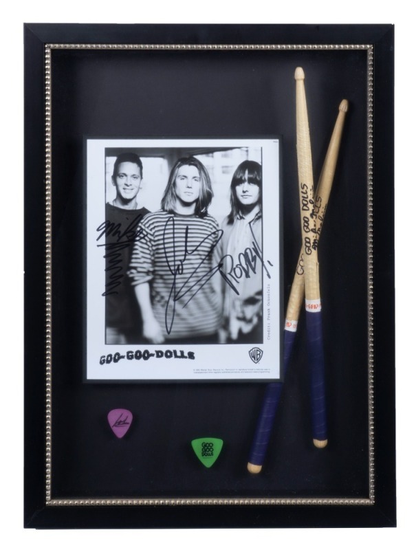 GOO GOO DOLLS SIGNED DRUMSTICKS, GUITAR PICK, AND PHOTOGRAPH DISPLAY