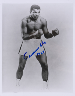 MUHAMMAD ALI "CASSIUS CLAY" SIGNED AND INSCRIBED EARLY PROFESSIONAL PROMO IMAGE