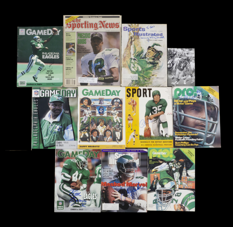 PHILADELPHIA EAGLES SIGNED PUBLICATIONS AND PHOTOGRAPH GROUP OF 11