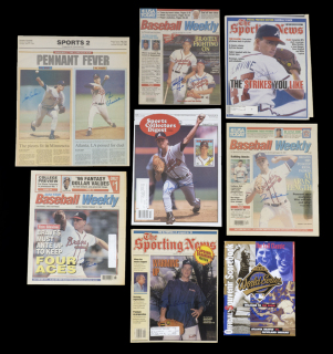 TOM GLAVINE SIGNED 1990s PUBLICATIONS AND WORLD SERIES PROGRAM GROUP OF EIGHT
